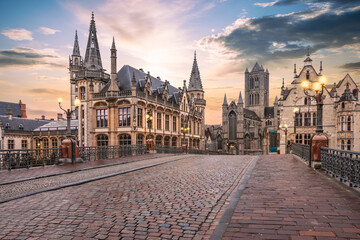 City of Ghent at sunset. Cobblestone street and historic buildings in Belgium.