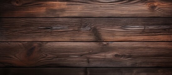 A dark oak wood background with a grainy surface texture, showcasing the intricate details and natural patterns of the wood grain. The surface appears rough and textured, adding depth and visual