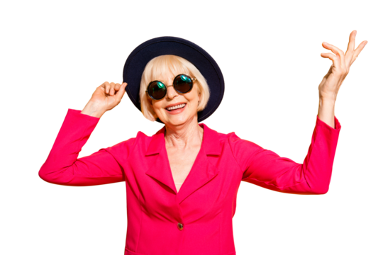 Close up portrait of fashioned and smiling granny hold han in the hands and looking at camera isolated on vivid yellow background - Powered by Adobe