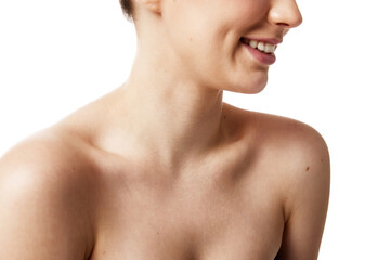 Crop portrait of young Caucasian woman with naked shoulders against white studio background....