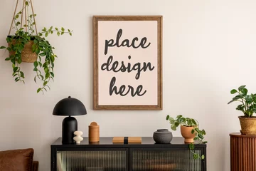 Poster Creative composition of living room interior with mock up poster frame, black commode, modern lamp, books, plants and personal accessories. Home decor. Template. © FollowTheFlow