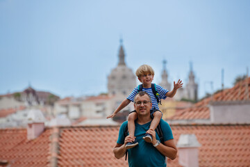 Joyous kid on fathers shoulder at Lisbon viewpoint, Portugal - 755576795