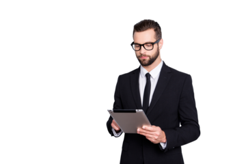 Portrait of busy concentrated man with modern hairstyle having tablet in hands, checking email, chatting with partners, expertising, analyzing, isolated over grey background