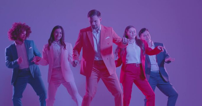 Dynamic group of young dancer, active people dressed in colorful business suits dancing amidst neon light flashes. The scene exudes energy and joy, with disco music adding to the lively atmosphere.