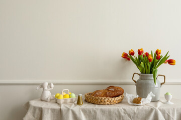 Minimalist composition of living room nterior with copy space, vase with tulips, bread in basket, colorful easter eggs, easter bunny sculpture and personal accessories. Home decor. Template. - obrazy, fototapety, plakaty