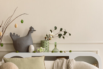 Creative composition of easter living room interior with copy space, hen sculpture, easter eggs,...