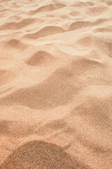Fototapeta na wymiar Beach sand background, Tropical tourist resort brown sandy surface for vacation design concept.