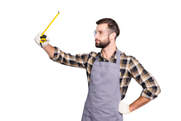 Portrait of thoughtful busy carpenter with tape-line, roulette holding hand on waist, measuring checking, isolated over grey background