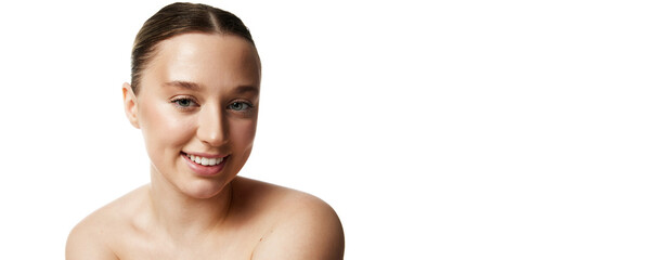 Banner. Smiling beautiful woman with bare shoulders looking at camera against white studio...