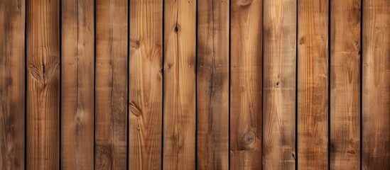A weathered brown wooden wall with vertical pine planks, showcasing a textured surface with visible knots and natural imperfections. The wall exudes a rustic charm with its aged appearance.