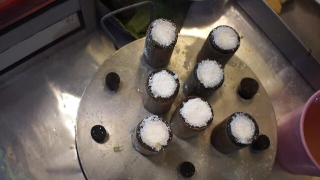 Medan putu bamboo cake being steamed seen from above