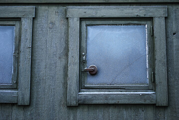 old wooden door and window in frost