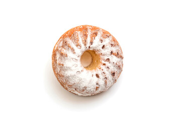 Cupcake with powdered sugar on a white background, close-up