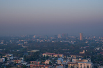 Obraz premium PM 2.5 dust, Bad air pollution in the City. Dangerous dust in Chiang Mai City Thailand, The city is covered by heavy smog. Misty mornings with bad air pollution, Place at risk of cancer.