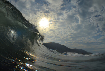 an impressive wave on a beach in the Caribbean Sea