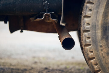 Rusty exhaust pipe of an old truck