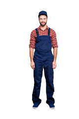 Fototapeta premium Full body size portrait of attractive positive bearded mechanic with stubble in blue overall shirt cap looking at camera, isolated over grey background