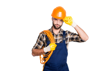 Portrait of virile harsh electrician with bristle in overall, shirt, having rolled cable on shoulder, holding hand on hardhat, standing over grey background