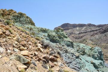 Fototapeta na wymiar Green rocks in El Teide National Park in Tenerife, Spain