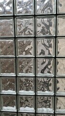 Texture of the wall. Glass blocks illuminated by even daylight.