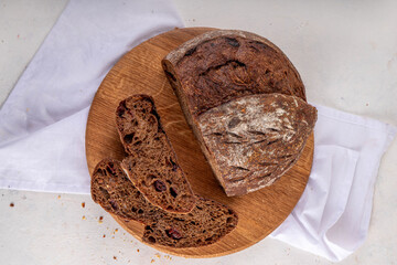 Homemade freshly baked sourdough bread. Craft homemade baked bread, rye and white, on a white...