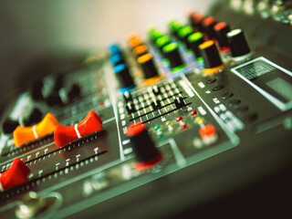 Close-up of sound recording equipment knobs.Mixer control. Music engineer. Backstage controls on an...