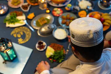 Ramadan Iftar Table. Muslim Family Having Dinner At Home. Iftar Table with Traditional Food. Fasting ends with Dates. Ramadan Feast Celebrations, Eid Mubarak Concept Uskudar Istanbul, Turkiye (Turkey) - obrazy, fototapety, plakaty