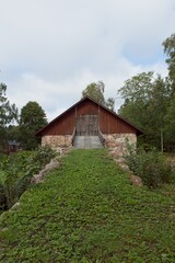 Fototapeta na wymiar Scenic view of old traditional style stone barn, Finland.