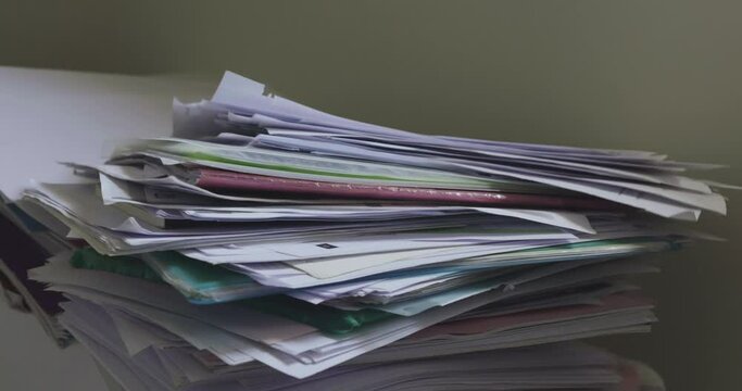 Large pile of papers dropped on floor, Too much work

