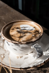 a cup of coffee, sunshine shadows