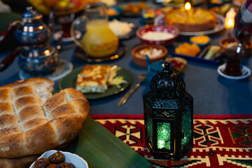 Ramadan Iftar Table. Muslim Family Having Dinner At Home. Iftar Table with Traditional Food. Fasting ends with Dates. Ramadan Feast Celebrations, Eid Mubarak Concept Uskudar Istanbul, Turkiye (Turkey)