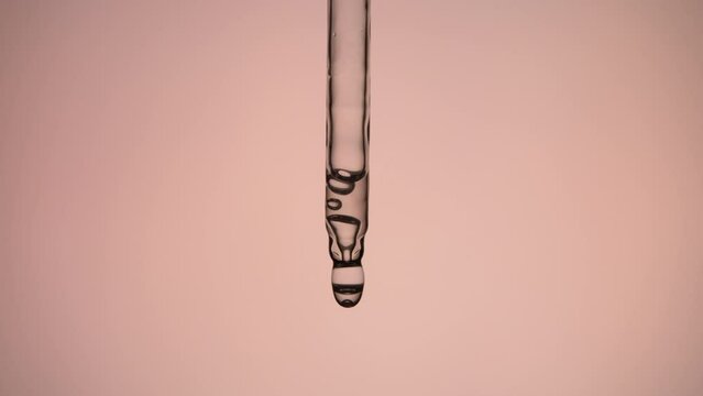 Applying cosmetic product on pink background