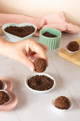 Brigadeiro brazilian chocolate balls party candy with chocolate flakes front view clean background