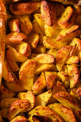 Crispy potato wedges baked with seasonings.