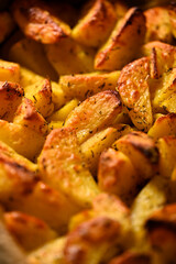 Crispy potato wedges baked with seasonings.