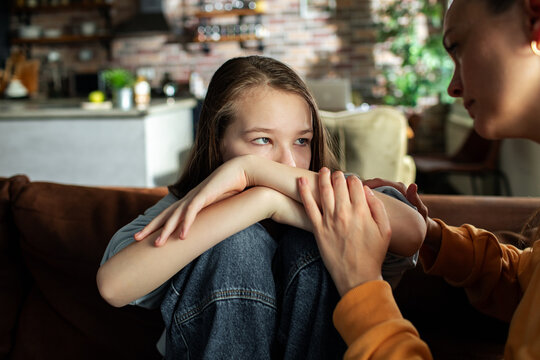 Mother and daughter having a serious conversation at home