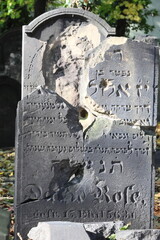Two jewish tombstones pierced by one bullet during WW2 [1] - obrazy, fototapety, plakaty