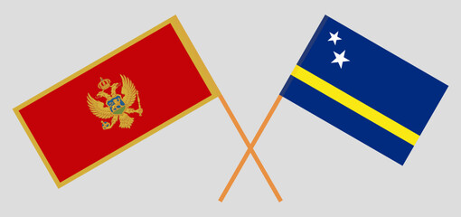 Crossed flags of Montenegro and Country of Curacao. Official colors. Correct proportion