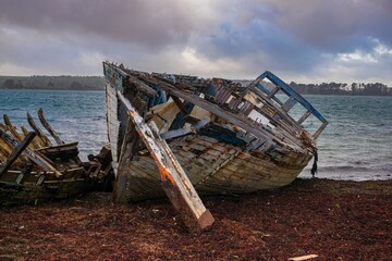 Old boats at the ship cemetery at the coastline of Brittany