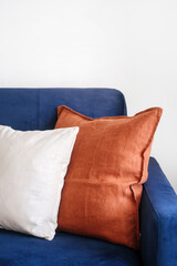 Closeup on decorative pillows on comfortable blue couch in living room