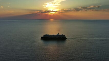 Aerial view at the cruise ship during sunset. Landscape with cruise liner on Adriatic sea. Adventure and travel, 4k