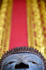 The bronze statue of Buddha in the temple, Vientiane, Laos