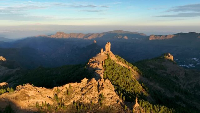 Aerial shot picturesque paradise of Roque Nublo, Flight over of a volcanic rock in caldera of Tejeda, Gran Canaria, Canary islands, Spain.