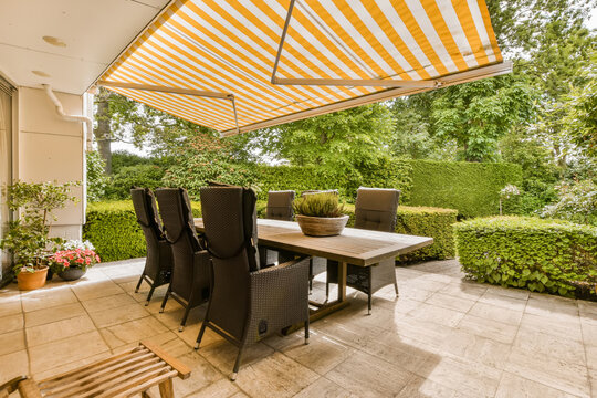 Elegant Patio Dining Area with Retractable Awning