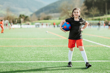 Young soccer player ready on field