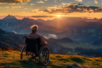 A photography of individual facing away sitting in a wheelchair - obrazy, fototapety, plakaty