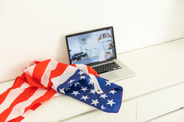 booking on the computer. laptop and american flag