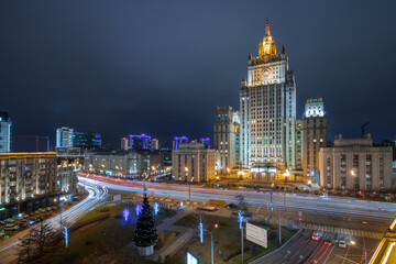 Ministry of Foreign Affairs building with illumination at winter dark night in Moscow, Russia - obrazy, fototapety, plakaty