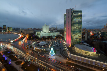 Fototapeta premium Government of Russian Federation, river and christmas tree at night in Moscow, long exposure