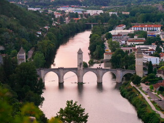 Fototapeta premium Valentre bridge with 3 towers in the evening light in Cahors, france
